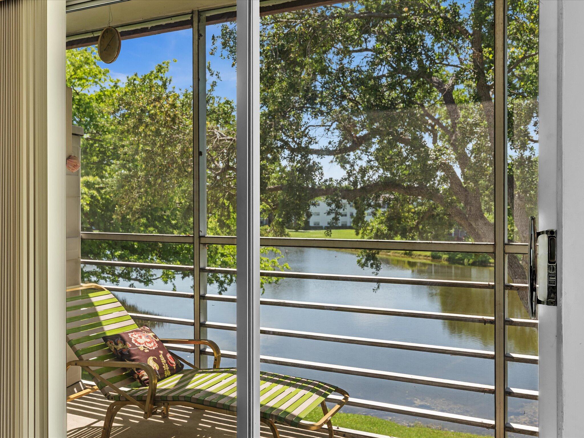 289 Fanshaw Drive, Unit G Boca Raton, FL 33434 - Photo 16 of 39 a view of a glass door with a balcony