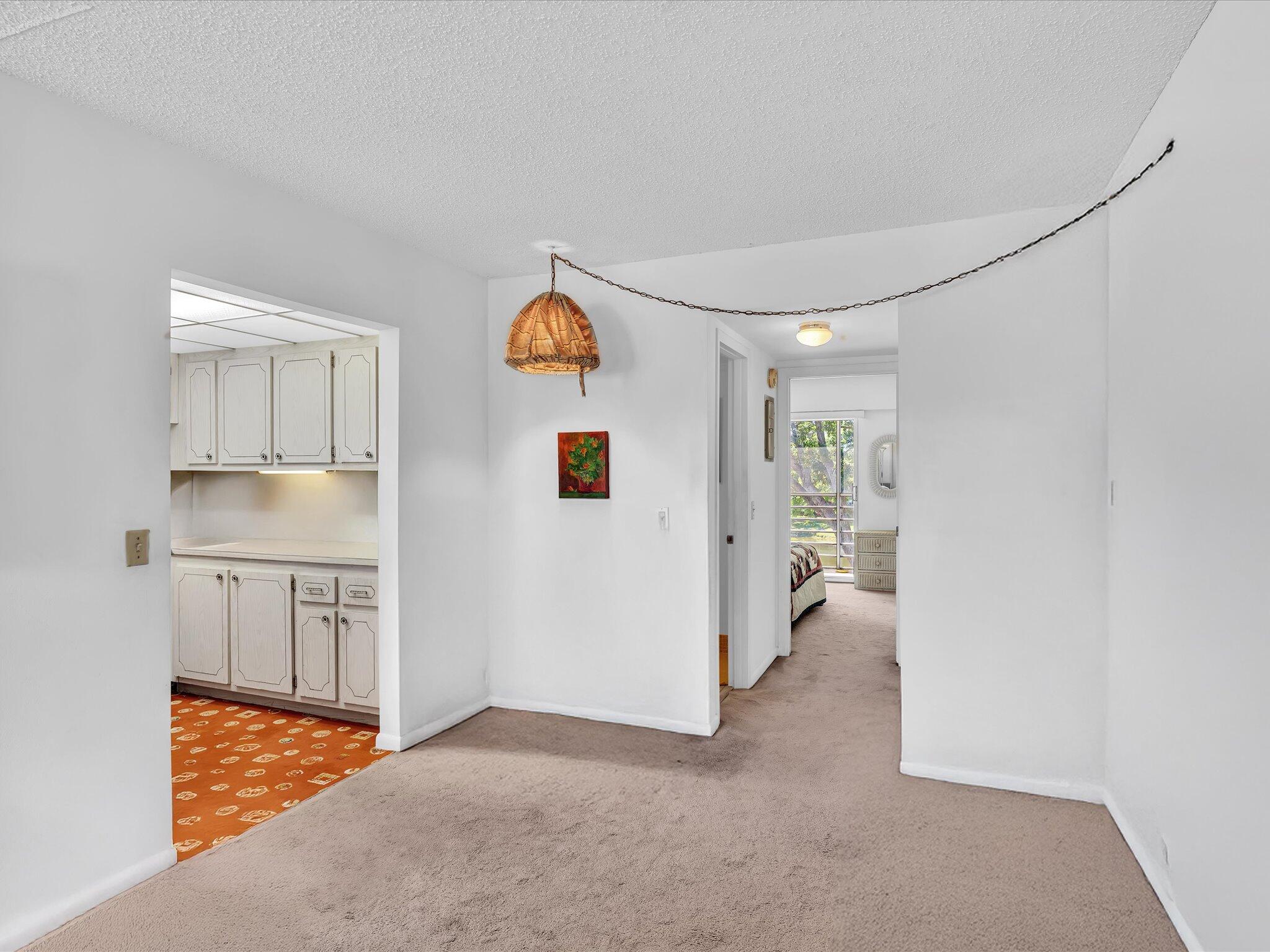 289 Fanshaw Drive, Unit G Boca Raton, FL 33434 - Photo 7 of 39 a view of a kitchen with a sink and cabinets