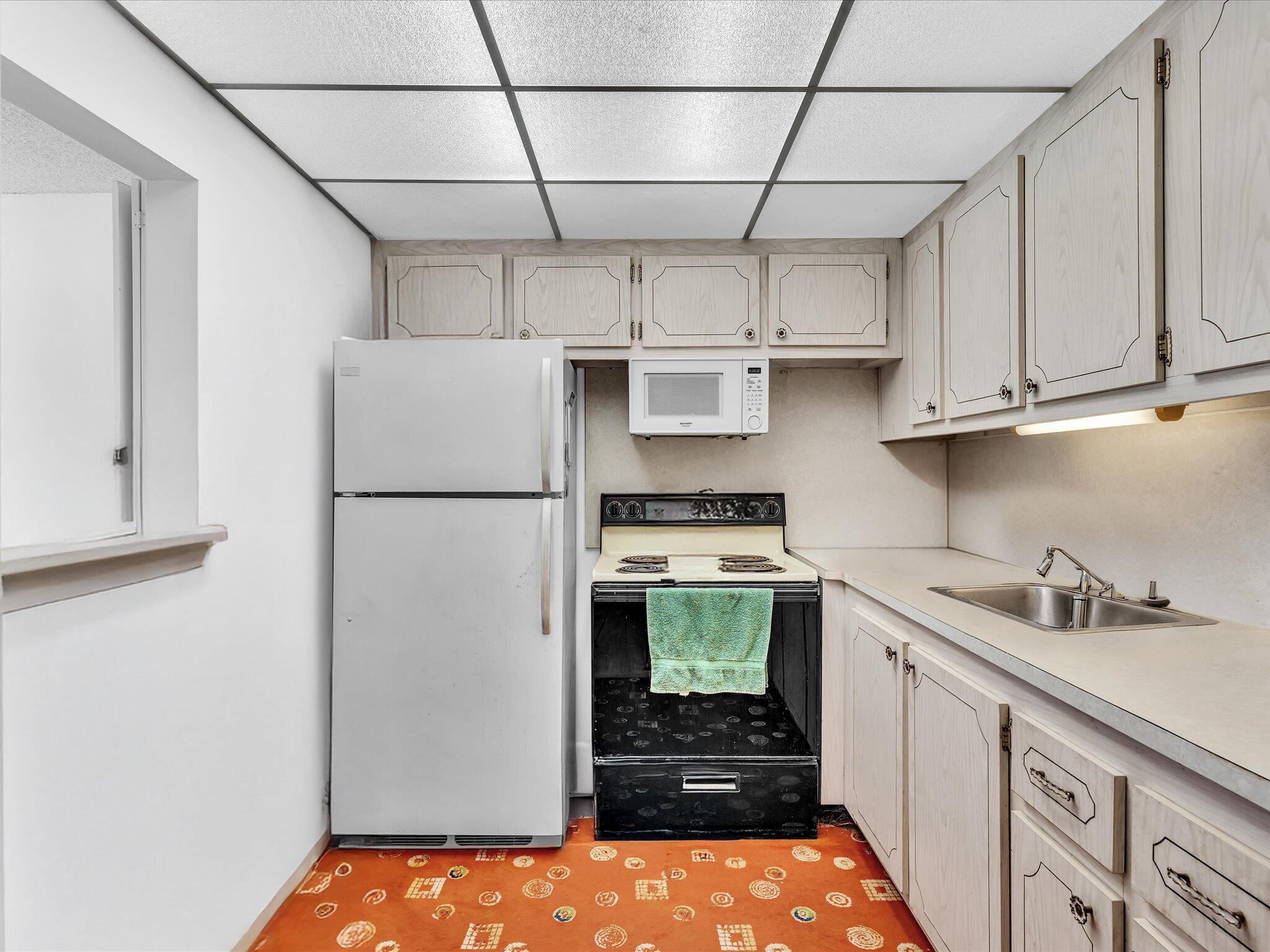 289 Fanshaw Drive, Unit G Boca Raton, FL 33434 - Photo 9 of 39 a room with storage and utility