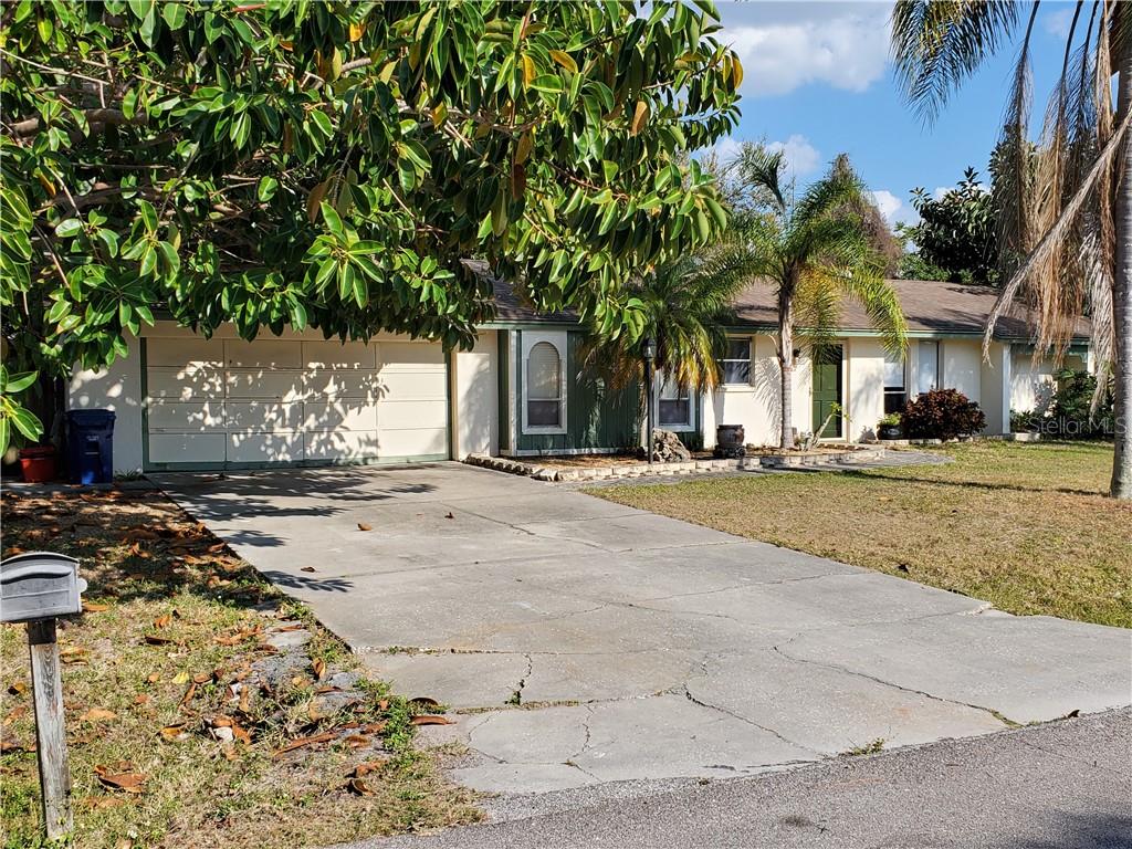 5847 Regent Road Venice, FL 34293 - Photo 1 of 1 a view of a building with a tree