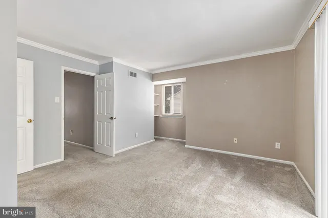 a bathroom with a granite countertop sink a toilet and a mirror