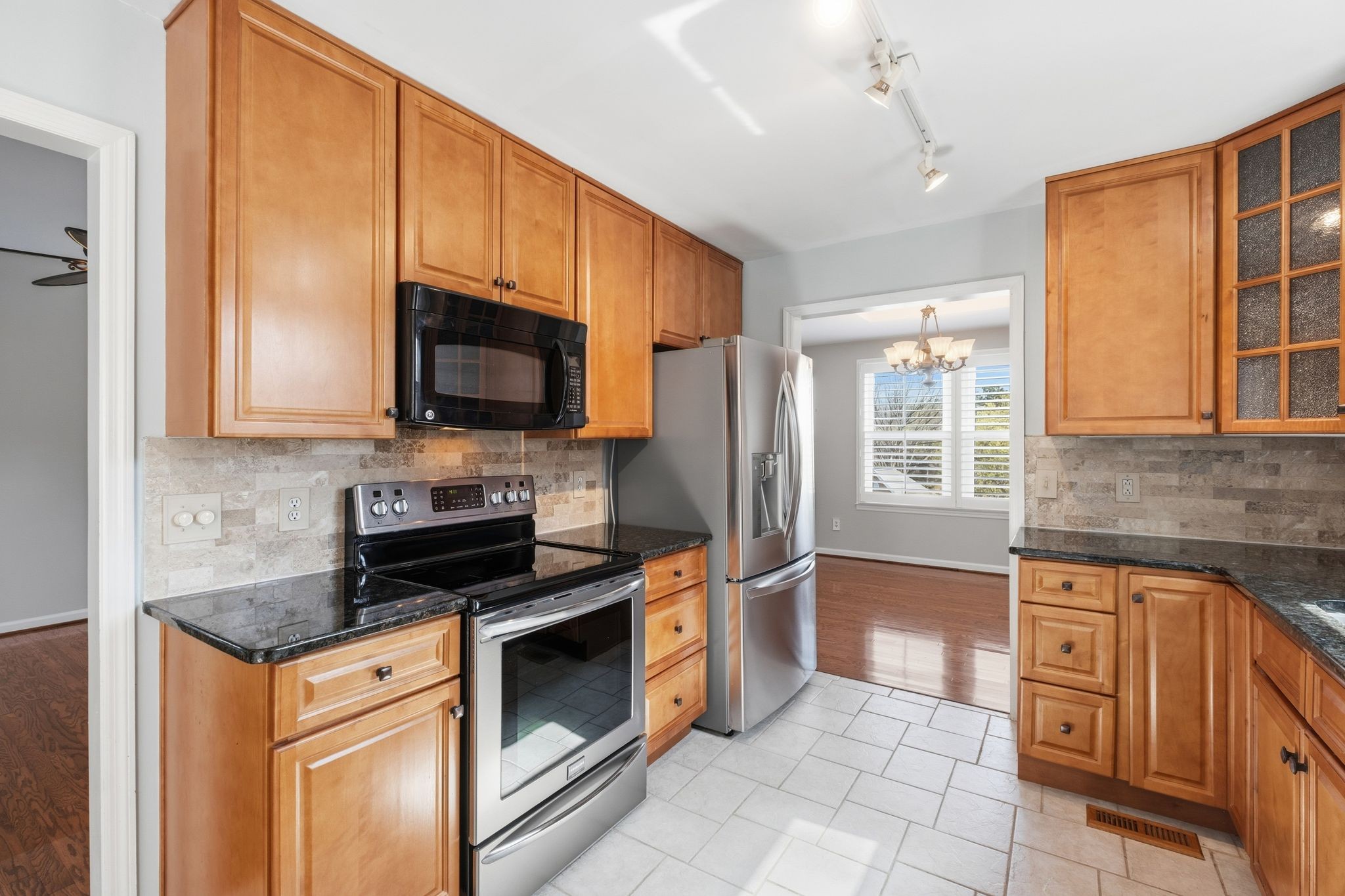 1049 Fitzpatrick Road Nashville, TN 37214 - Photo 12 of 38 a kitchen with stainless steel appliances granite countertop a stove a sink and a microwave