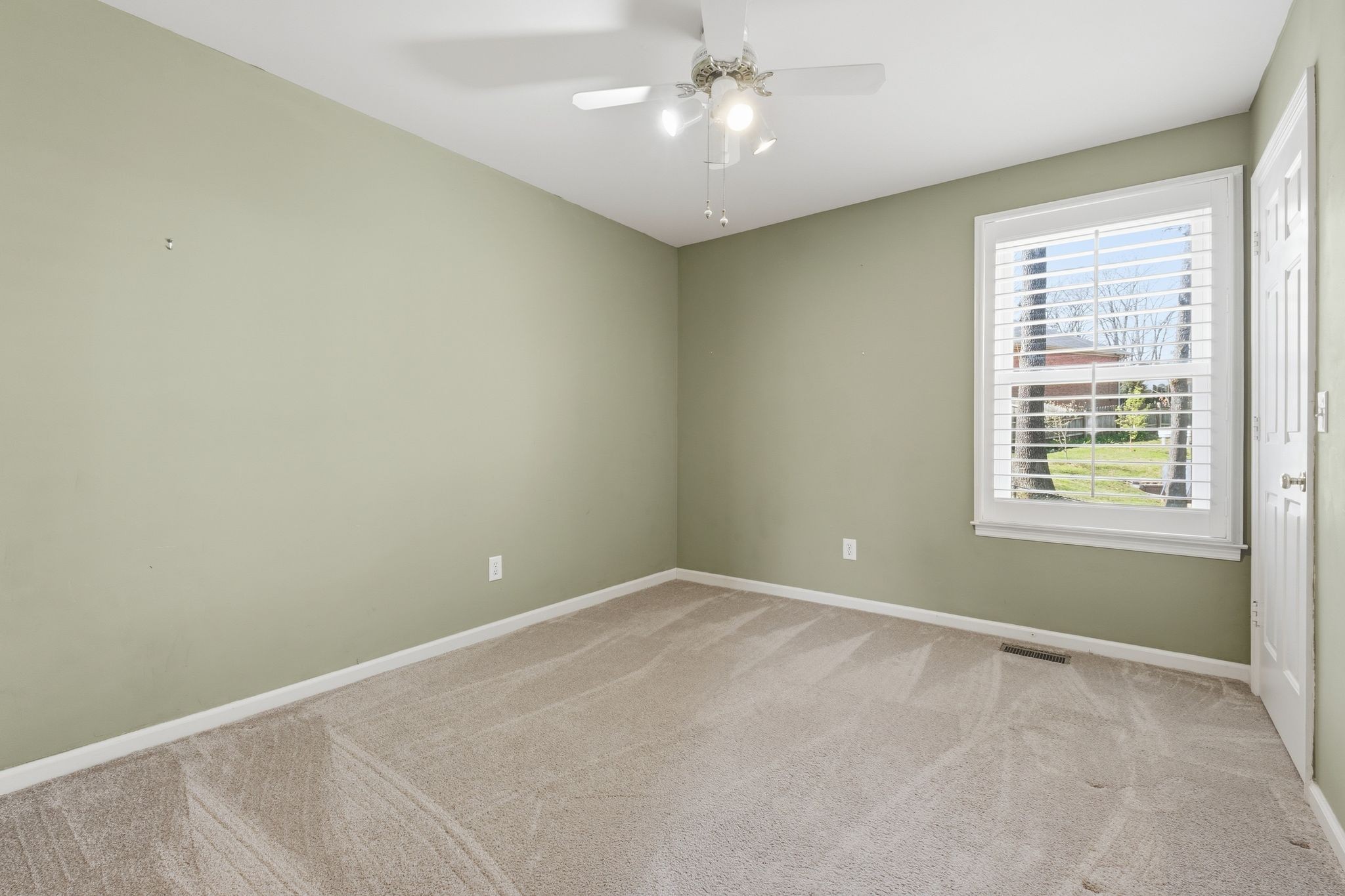 1049 Fitzpatrick Road Nashville, TN 37214 - Photo 21 of 38 an empty room with a fan & a window