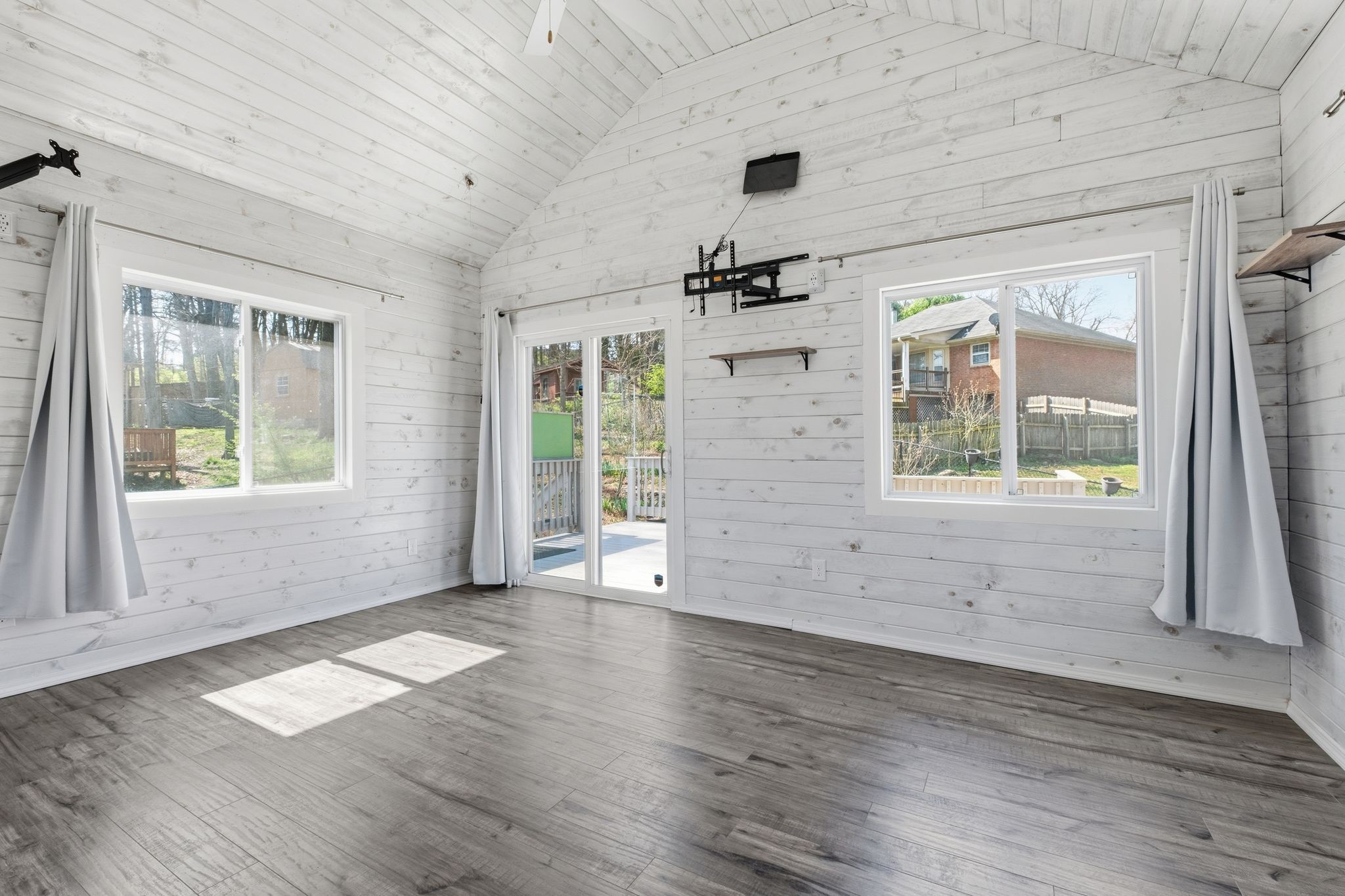 1049 Fitzpatrick Road Nashville, TN 37214 - Photo 30 of 38 an empty room with wooden floor and windows