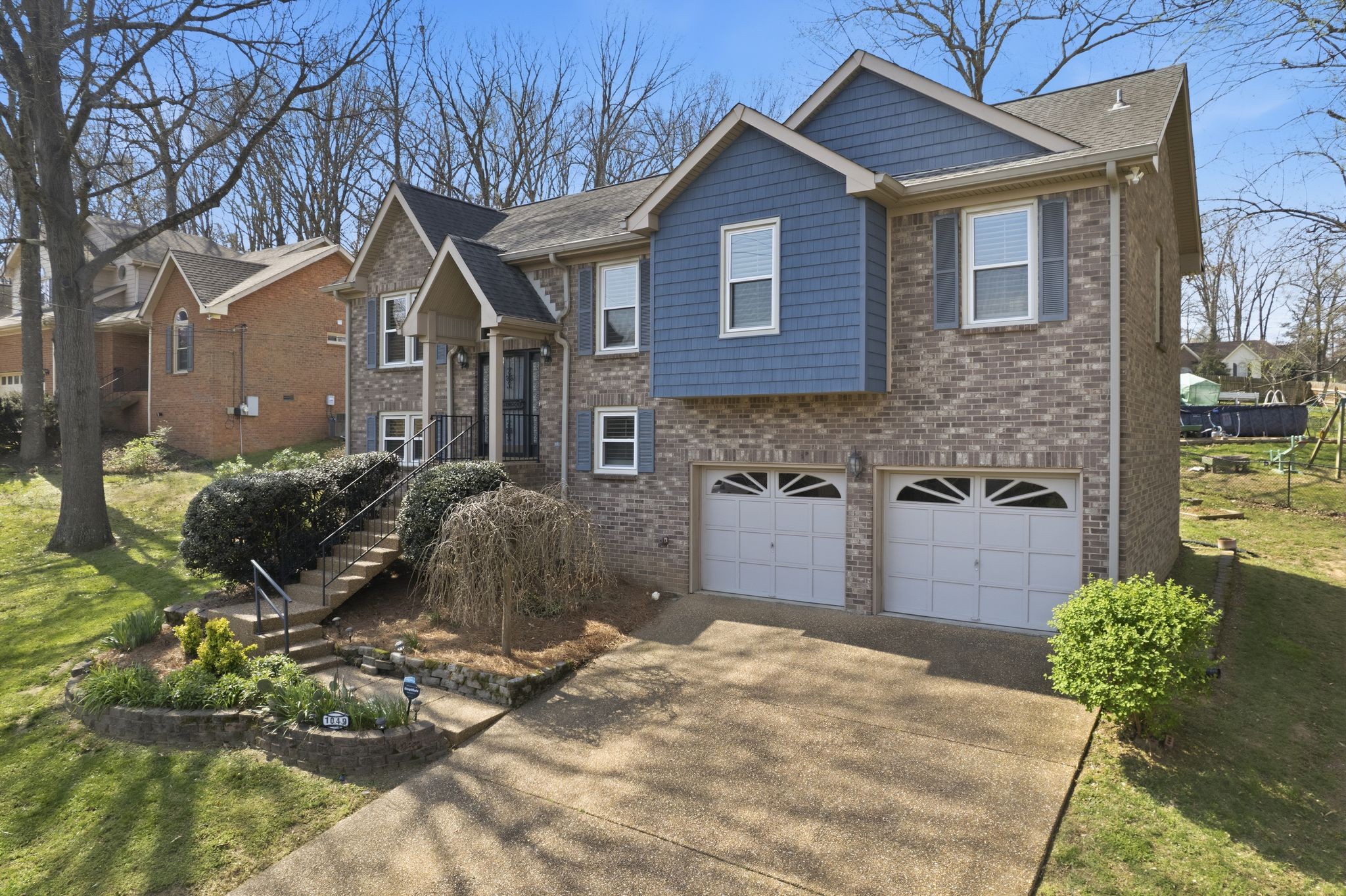 1049 Fitzpatrick Road Nashville, TN 37214 - Photo 37 of 38 a front view of a house with a yard