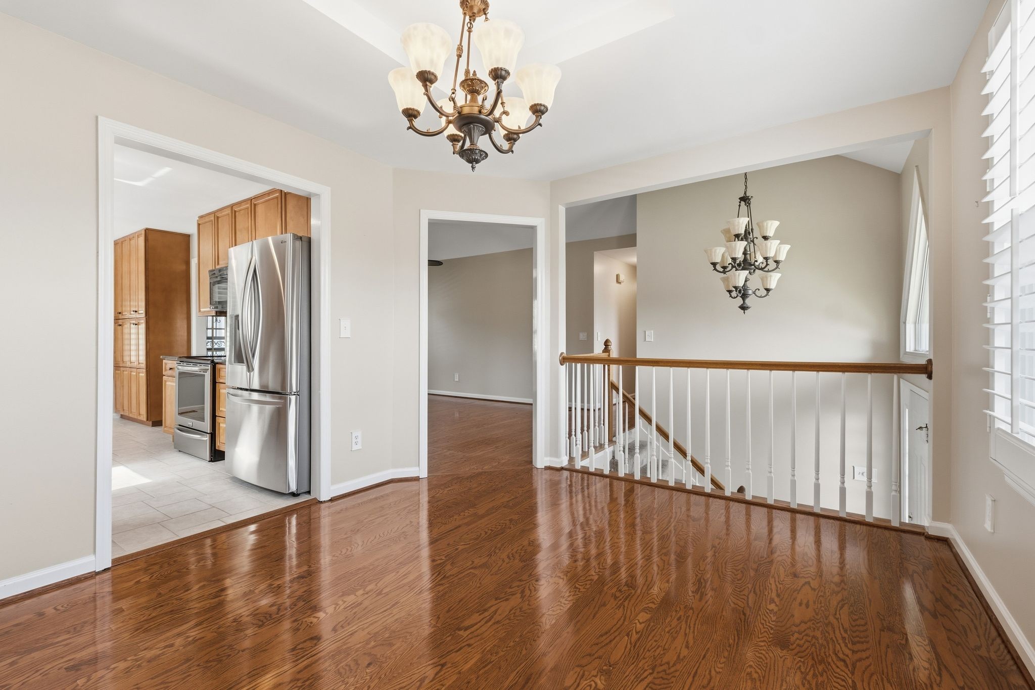 1049 Fitzpatrick Road Nashville, TN 37214 - Photo 9 of 38 a view of a hallway with wooden floor and chandelier