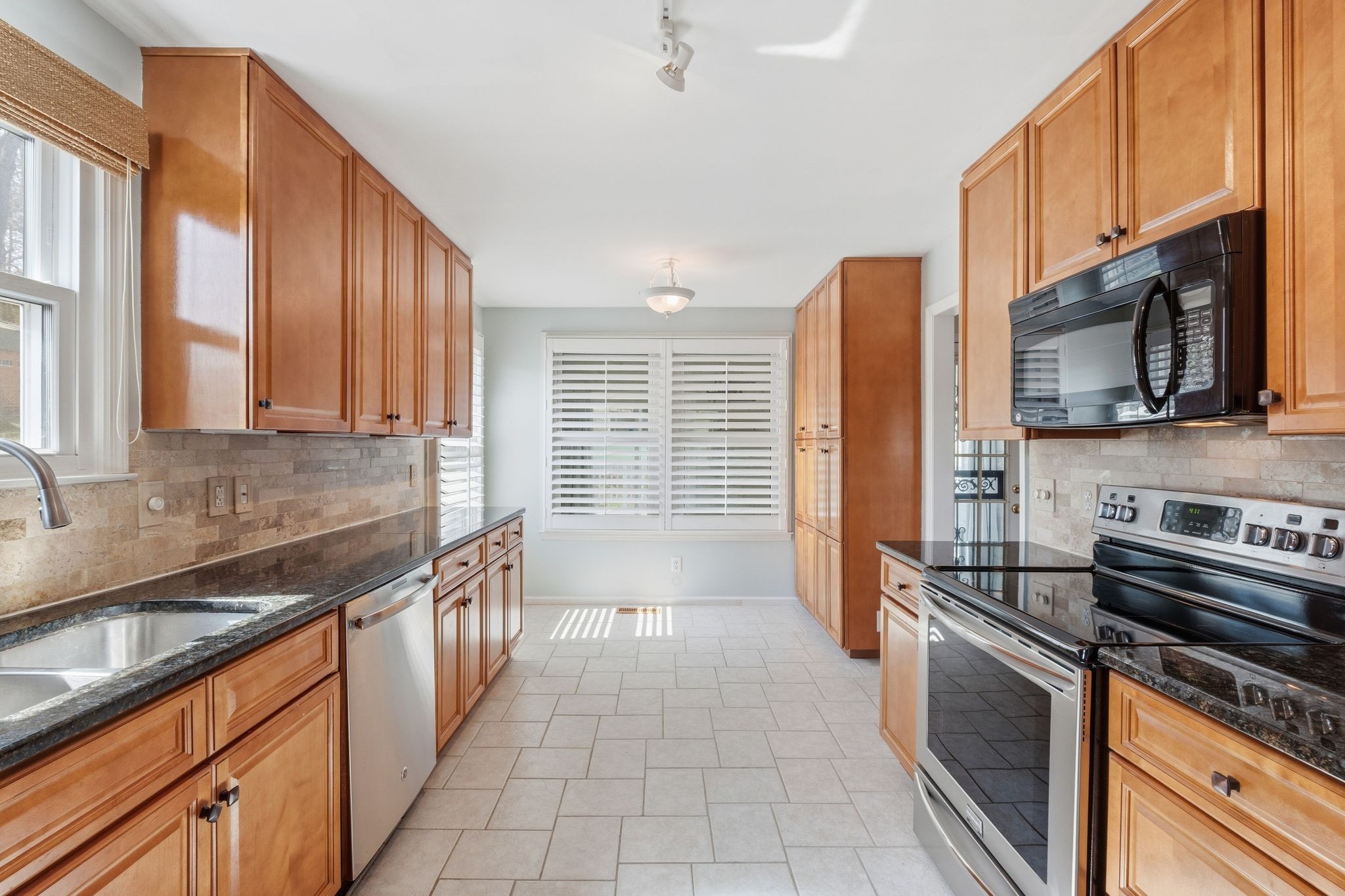 1049 Fitzpatrick Road Nashville, TN 37214 - Photo 10 of 38 a kitchen with stainless steel appliances a sink a stove a microwave and cabinets