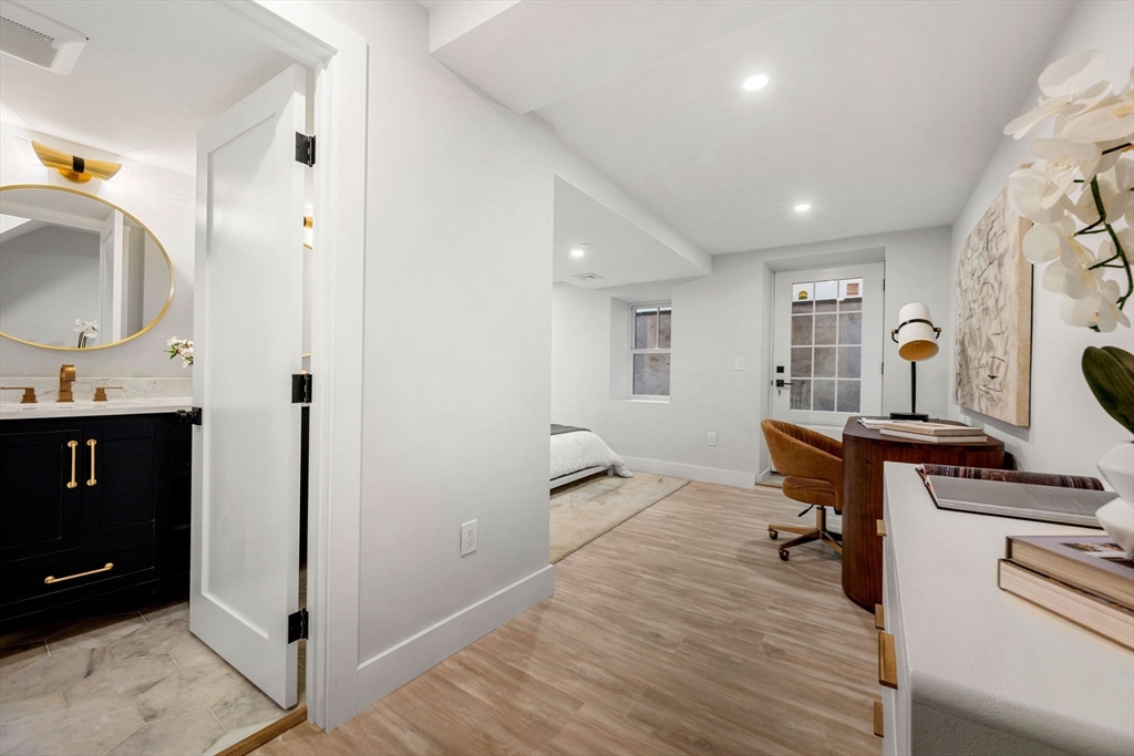 67 Revere Street, Unit 1 Boston, MA 02114 - Photo 15 of 29 a workspace with furniture and window