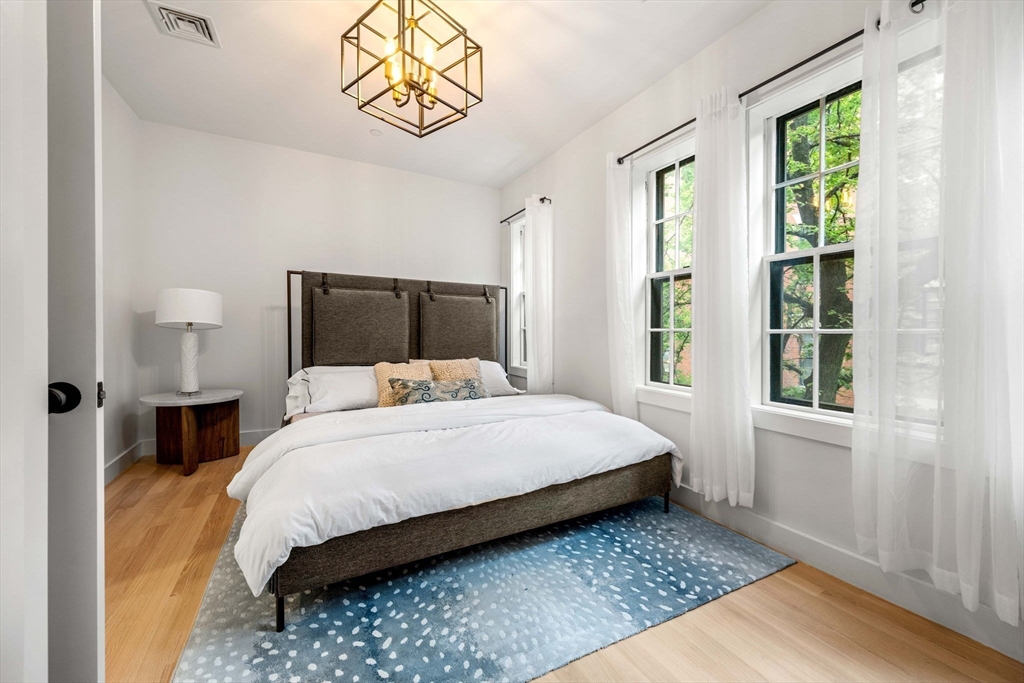 67 Revere Street, Unit 1 Boston, MA 02114 - Photo 18 of 29 a bedroom with a bed and window