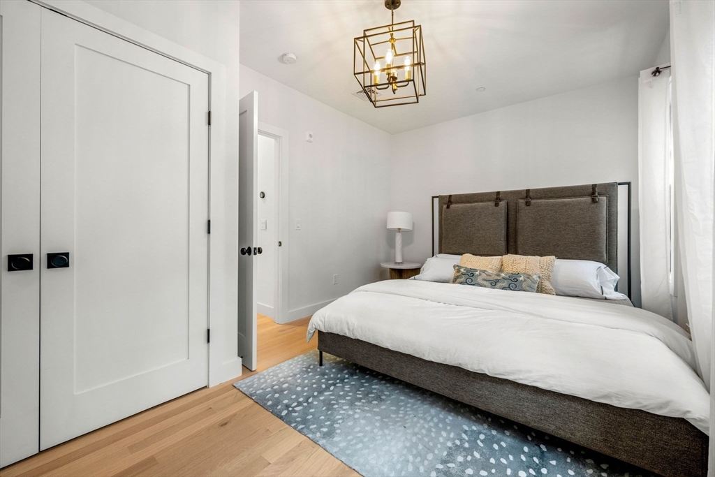 67 Revere Street, Unit 1 Boston, MA 02114 - Photo 19 of 29 a bedroom with a bed and a window
