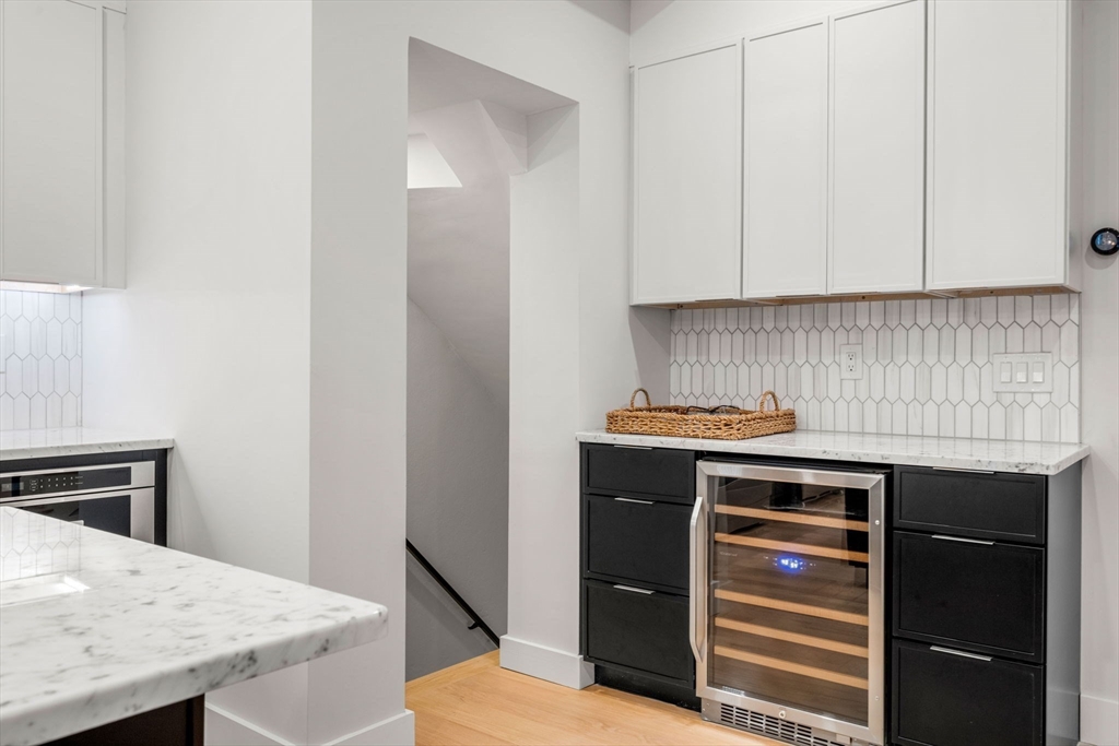 67 Revere Street, Unit 1 Boston, MA 02114 - Photo 7 of 29 a kitchen with a sink and cabinets