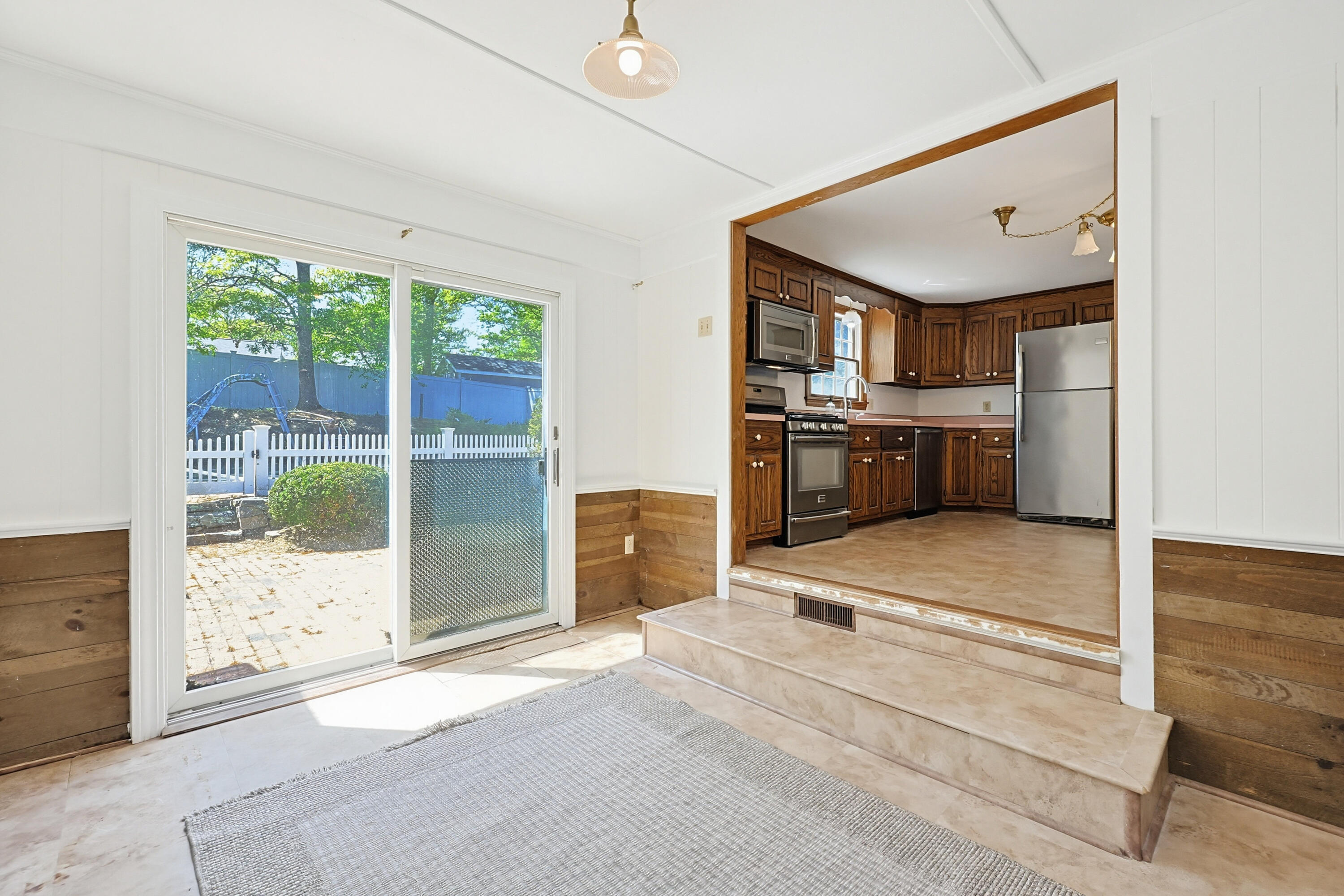 556 Cotuit Road Mashpee, MA 02649 - Photo 18 of 45 a room with kitchen island and stainless steel appliances