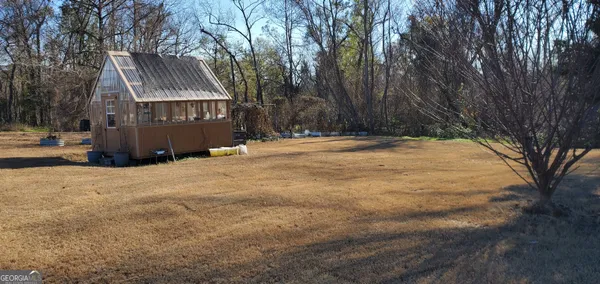 a view of balcony with wooden floor
