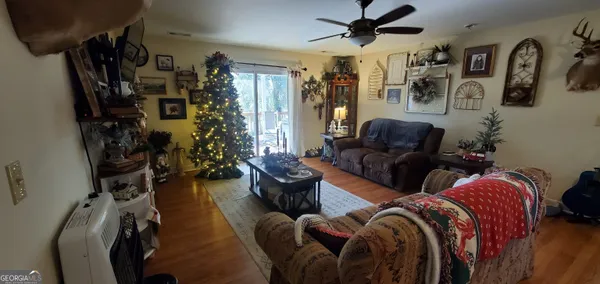 a room with gym equipment and a view of living room