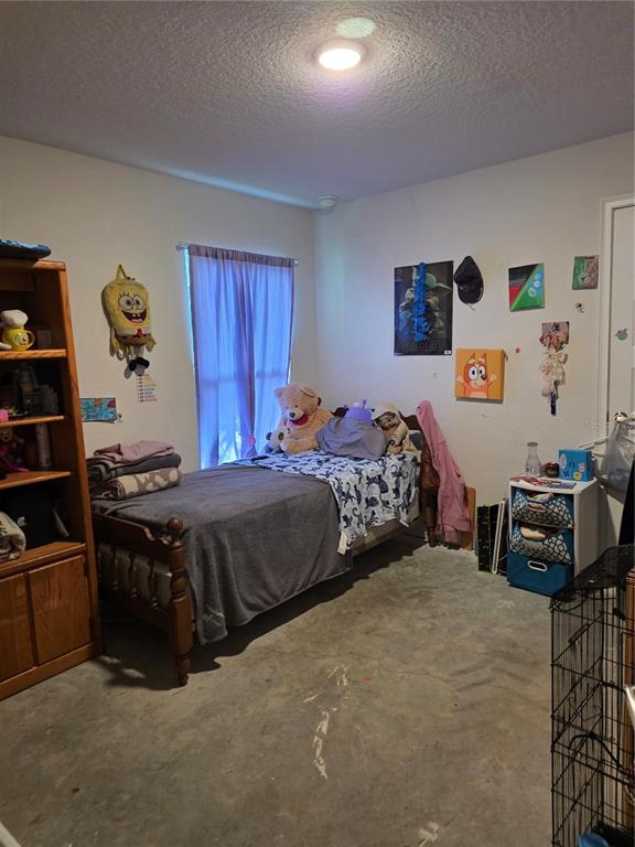 9 Cedar Run Ocala, FL 34472 - Photo 9 of 15 a bedroom with a bed and a couch