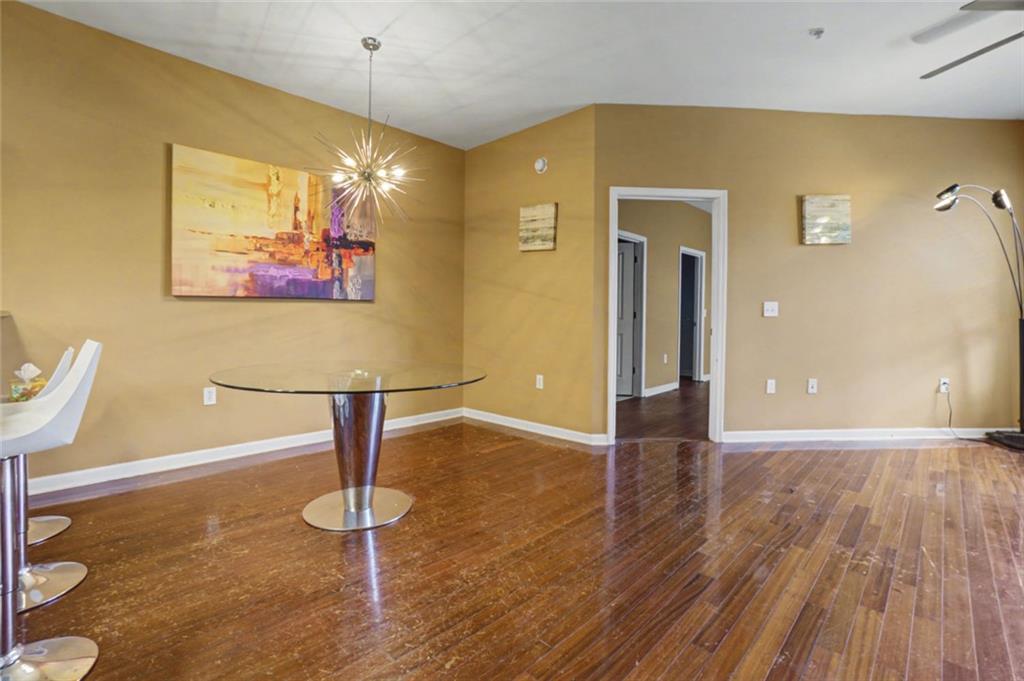 870 Mayson Turner Road Northwest, Unit 1311 Atlanta, GA 30314 - Photo 11 of 29 a view of a room with wooden floor and bench