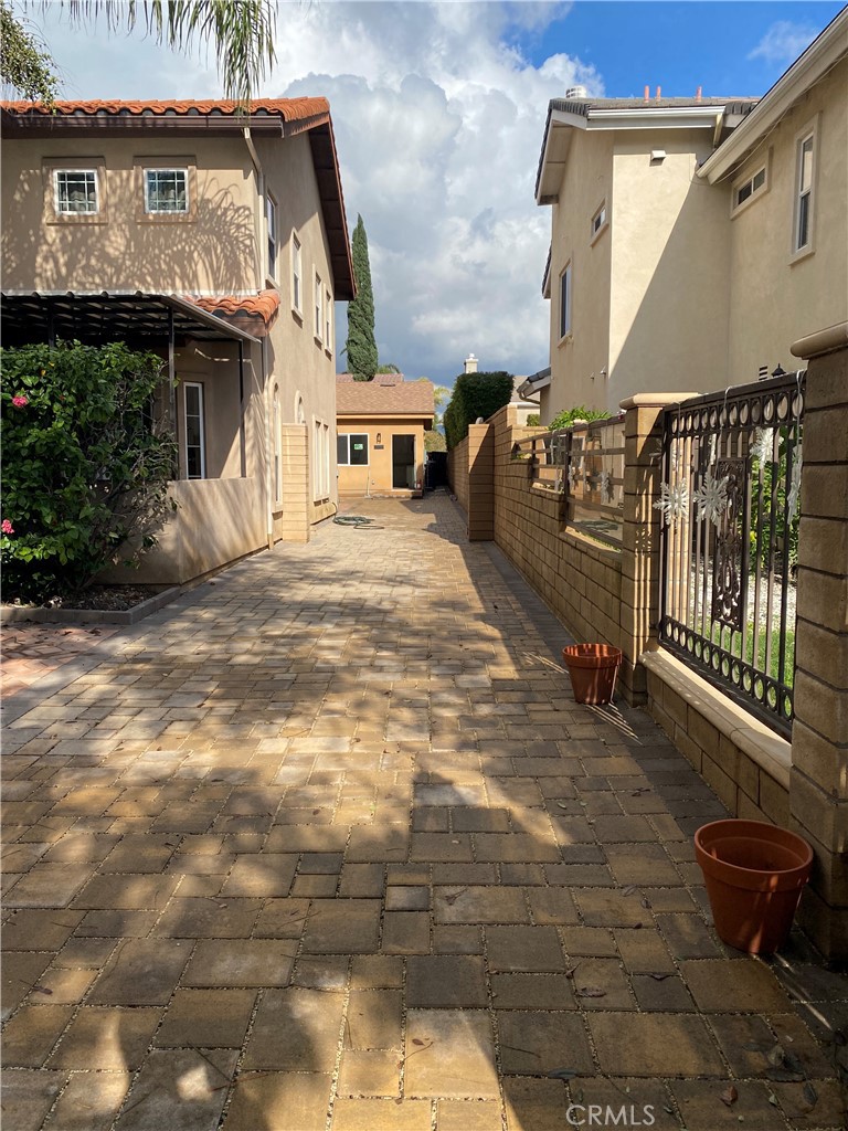 a view of a house with a street