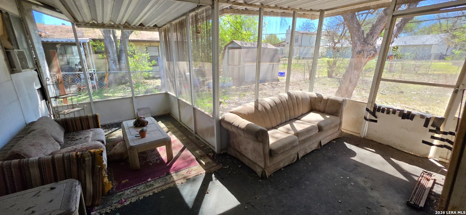 5414 Boatman Road Kirby, TX 78219 - Photo 2 of 15 a living room with furniture and a floor to ceiling window