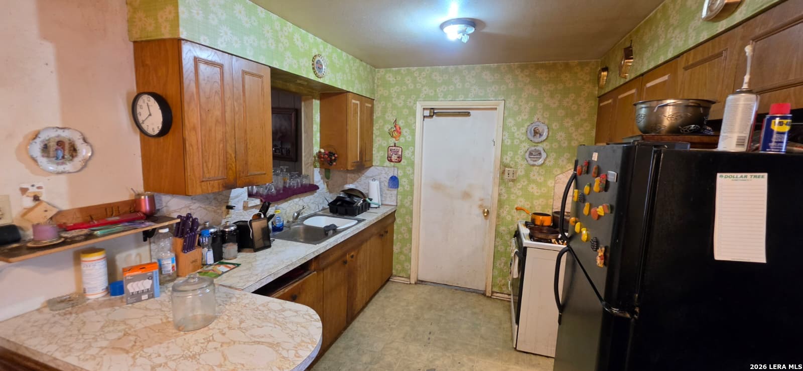 5414 Boatman Road Kirby, TX 78219 - Photo 6 of 15 a bathroom with a sink mirror and shower