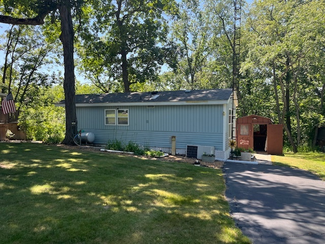 2795 East 28th Road Marseilles, IL 61341 - Photo 3 of 65 a backyard of a house with yard and outdoor seating