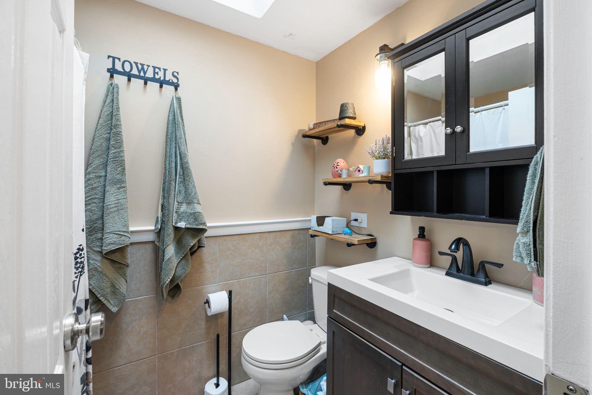 12313 Dunks Ferry Road Philadelphia, PA 19154 - Photo 13 of 29 a bathroom with a sink a toilet and a mirror