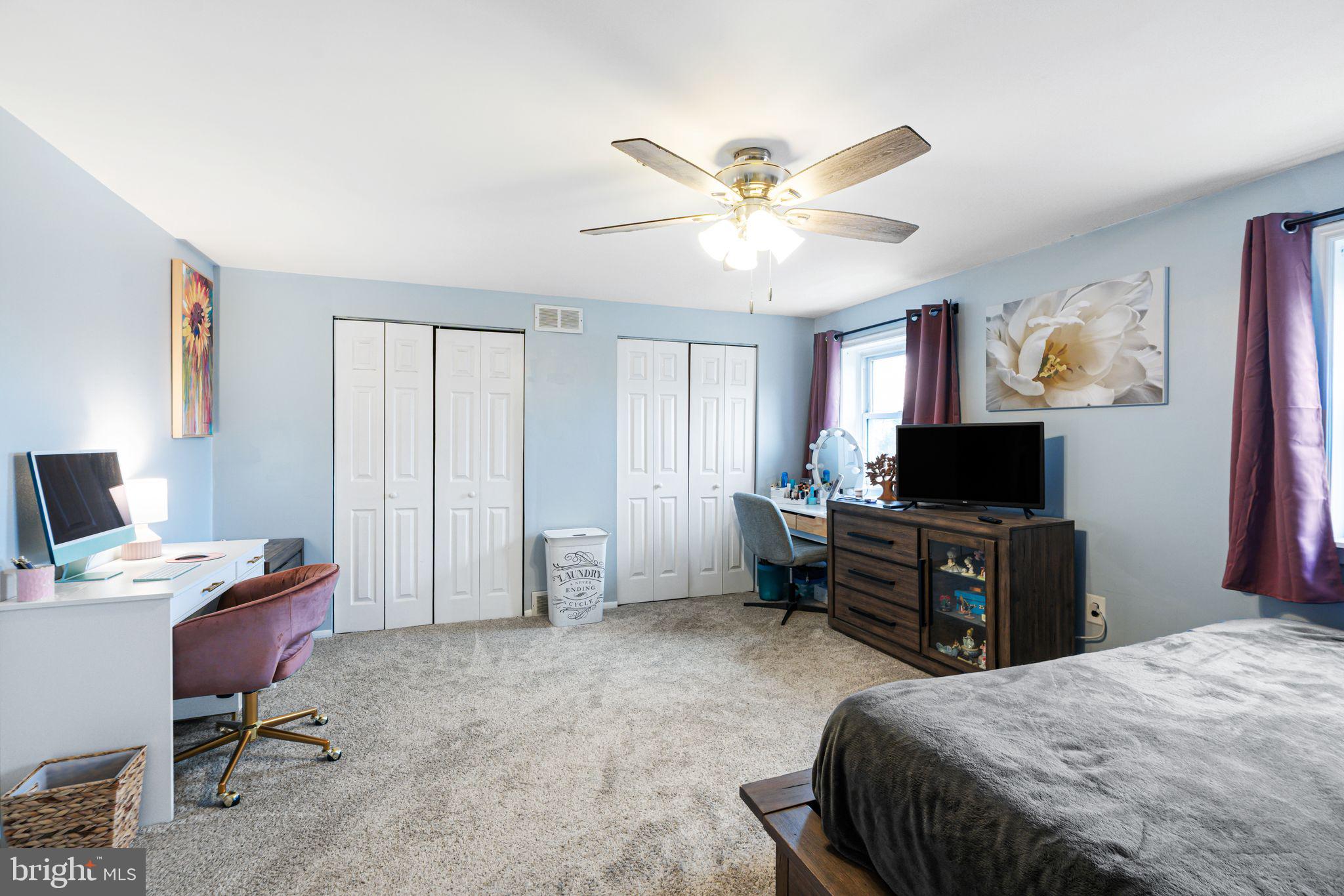12313 Dunks Ferry Road Philadelphia, PA 19154 - Photo 15 of 29 a bedroom with a bed and a flat screen tv
