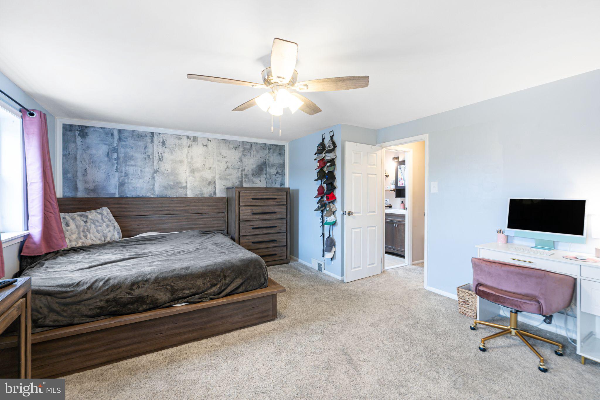 12313 Dunks Ferry Road Philadelphia, PA 19154 - Photo 16 of 29 a bedroom with a bed and a chandelier