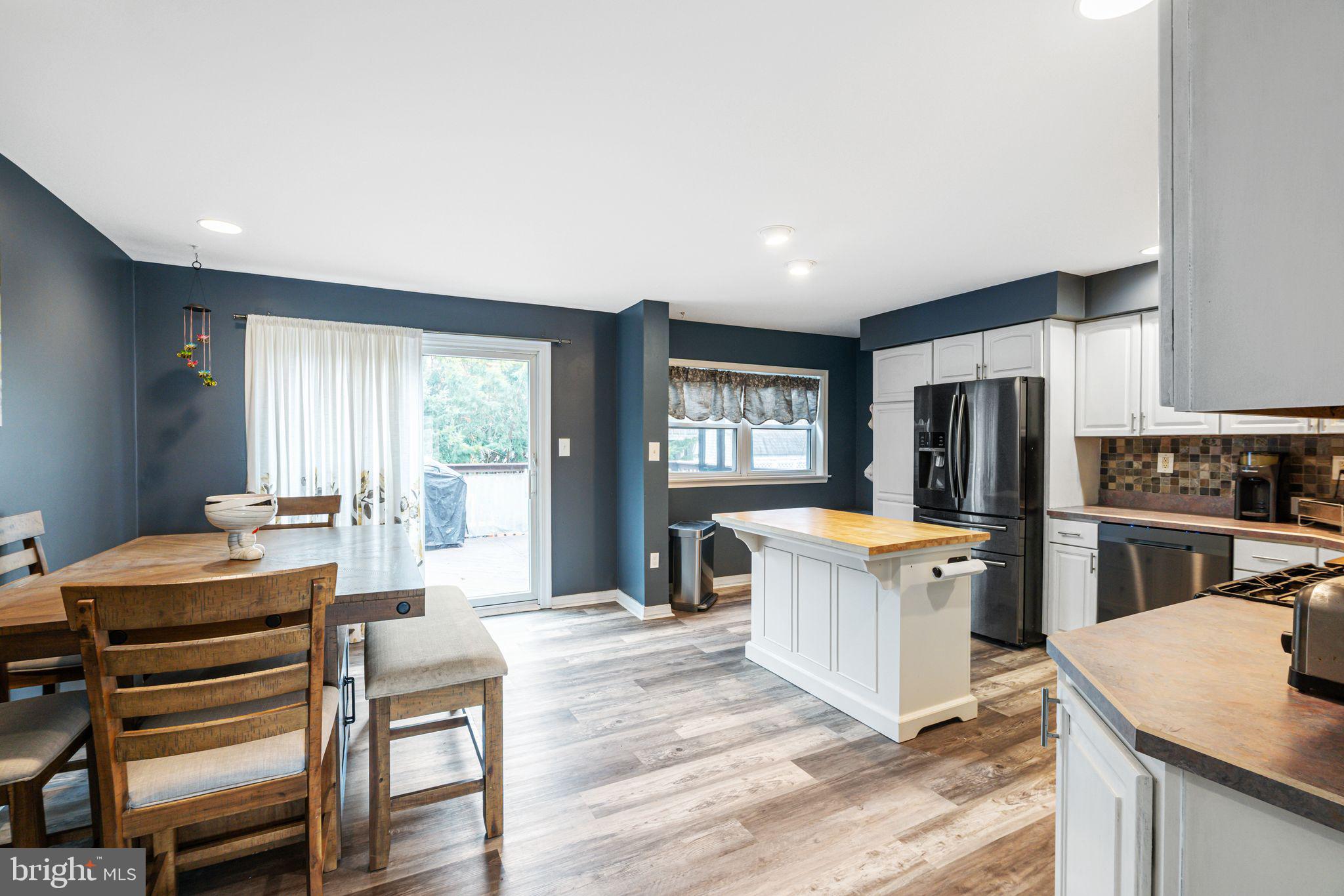 12313 Dunks Ferry Road Philadelphia, PA 19154 - Photo 6 of 29 a living room with stainless steel appliances kitchen island granite countertop furniture and a kitchen view