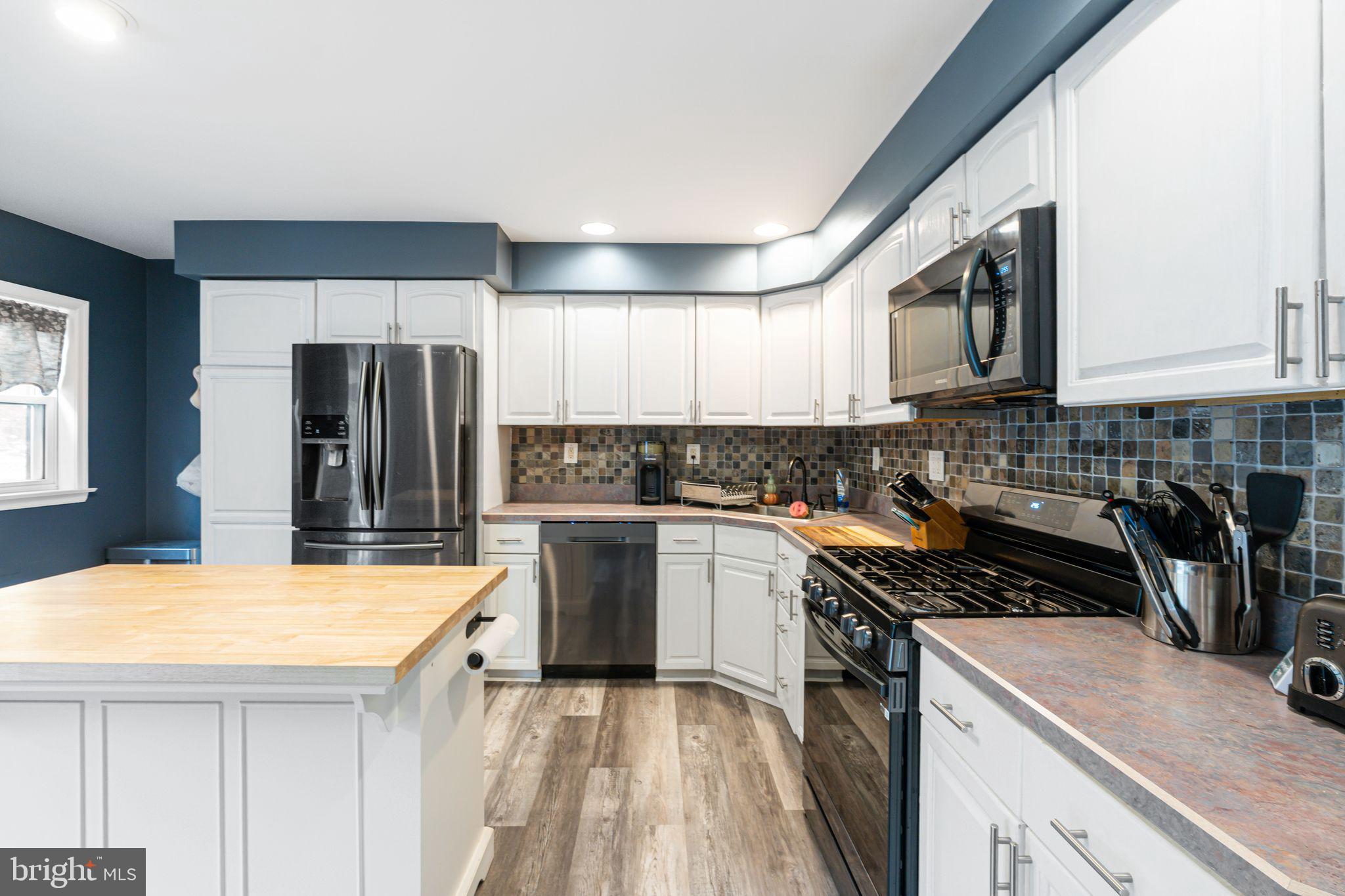 12313 Dunks Ferry Road Philadelphia, PA 19154 - Photo 7 of 29 a kitchen with a sink a stove and refrigerator
