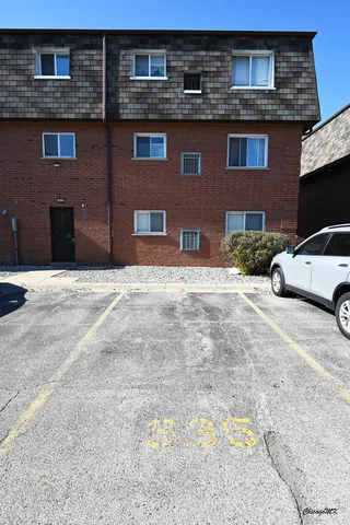 a view of a street with a building in the background