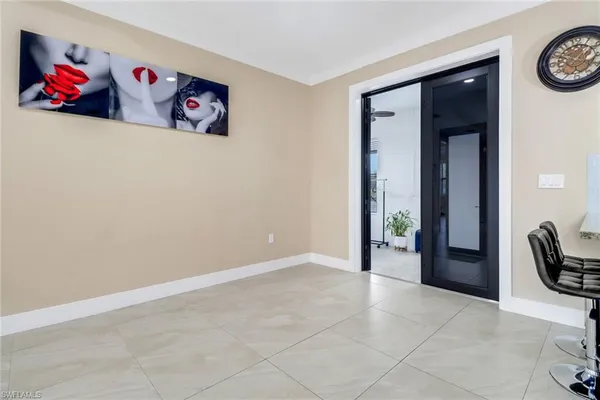 an entryway with a painting on the wall