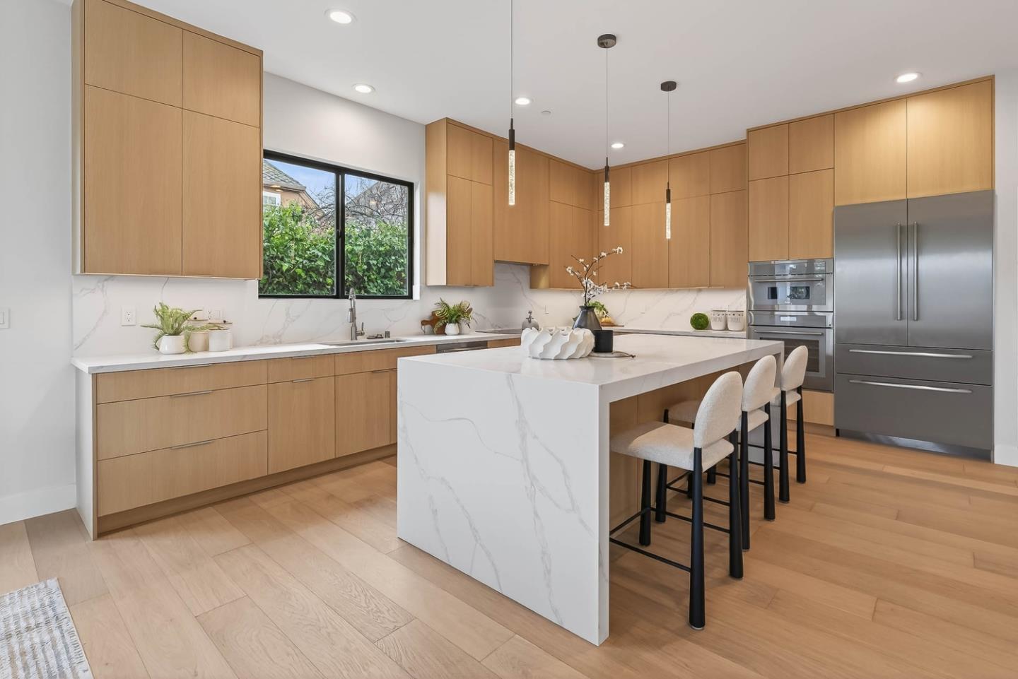 10468 South Stelling Road Cupertino, CA 95014 - Photo 9 of 45 a kitchen with stainless steel appliances kitchen island granite countertop a sink a stove a refrigerator and island with wooden floor