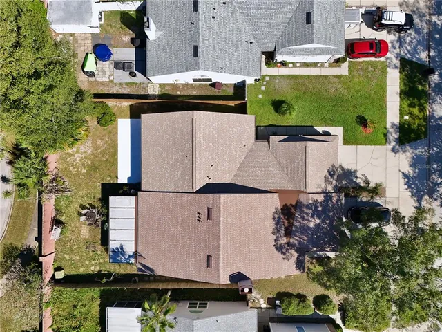 an aerial view of houses with outdoor space