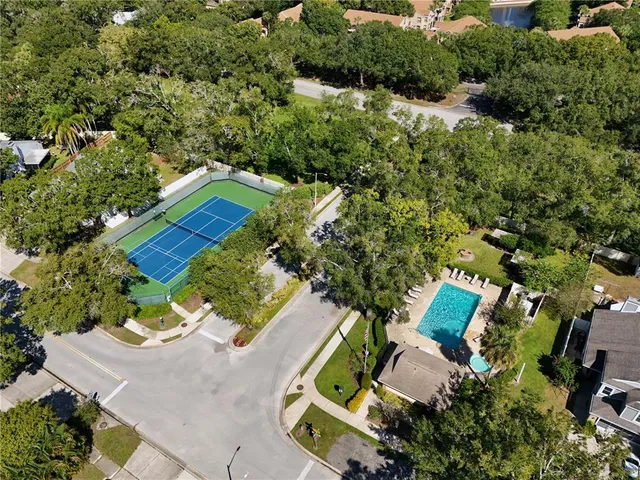 an aerial view of a house with outdoor space