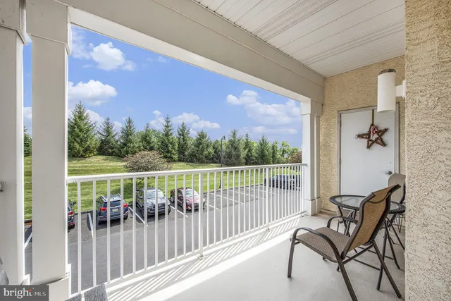 a view of a chair and table in the balcony