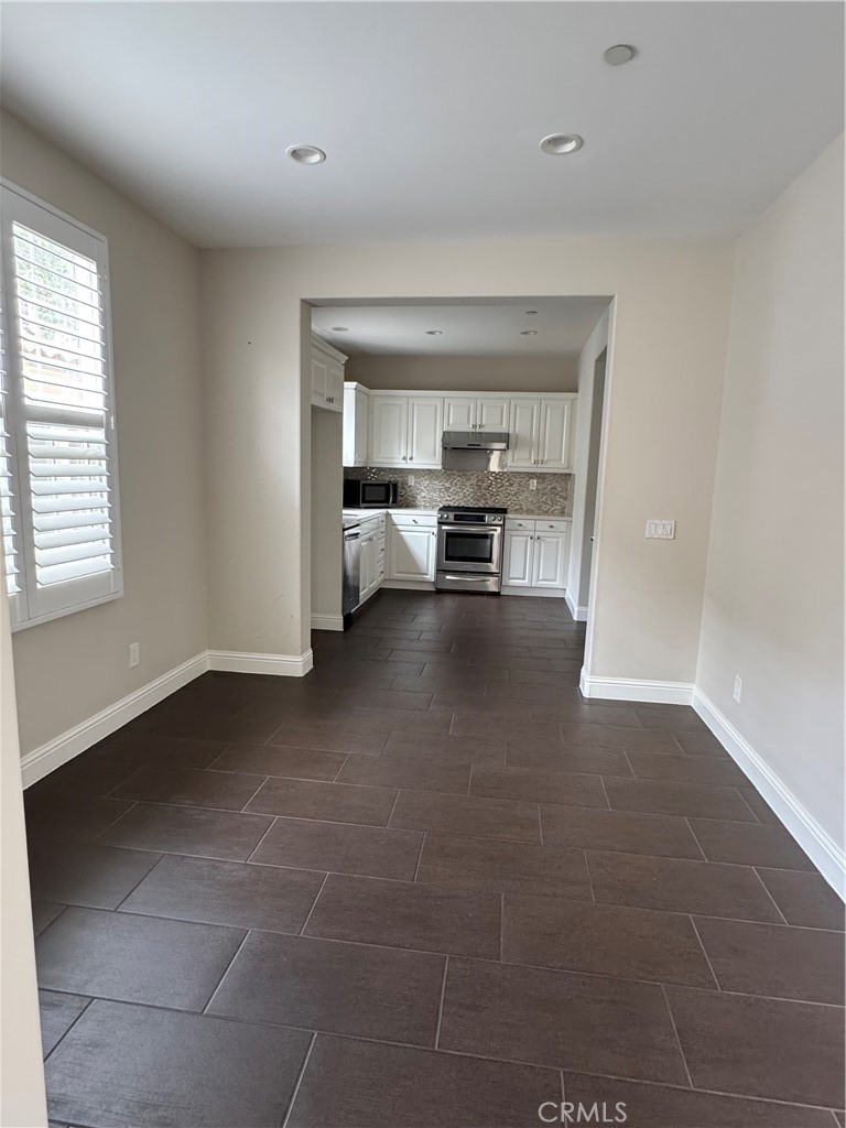 85 Canyoncrest Irvine, CA 92603 - Photo 4 of 12 a view of livingroom with furniture and window
