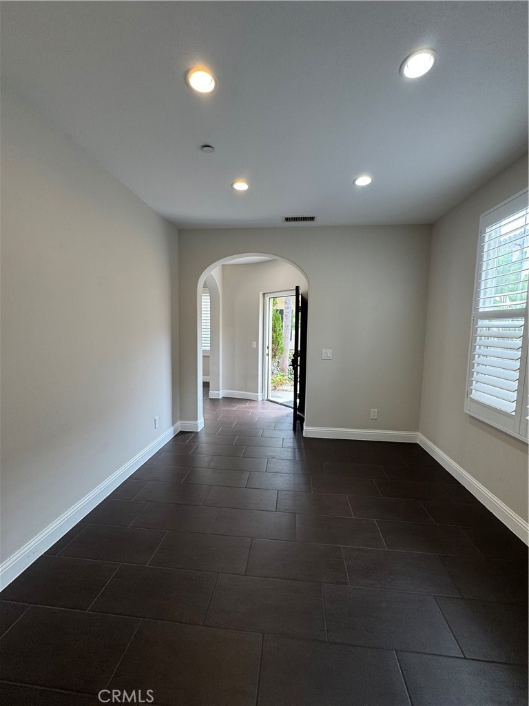 85 Canyoncrest Irvine, CA 92603 - Photo 6 of 12 an empty room with windows and entrance