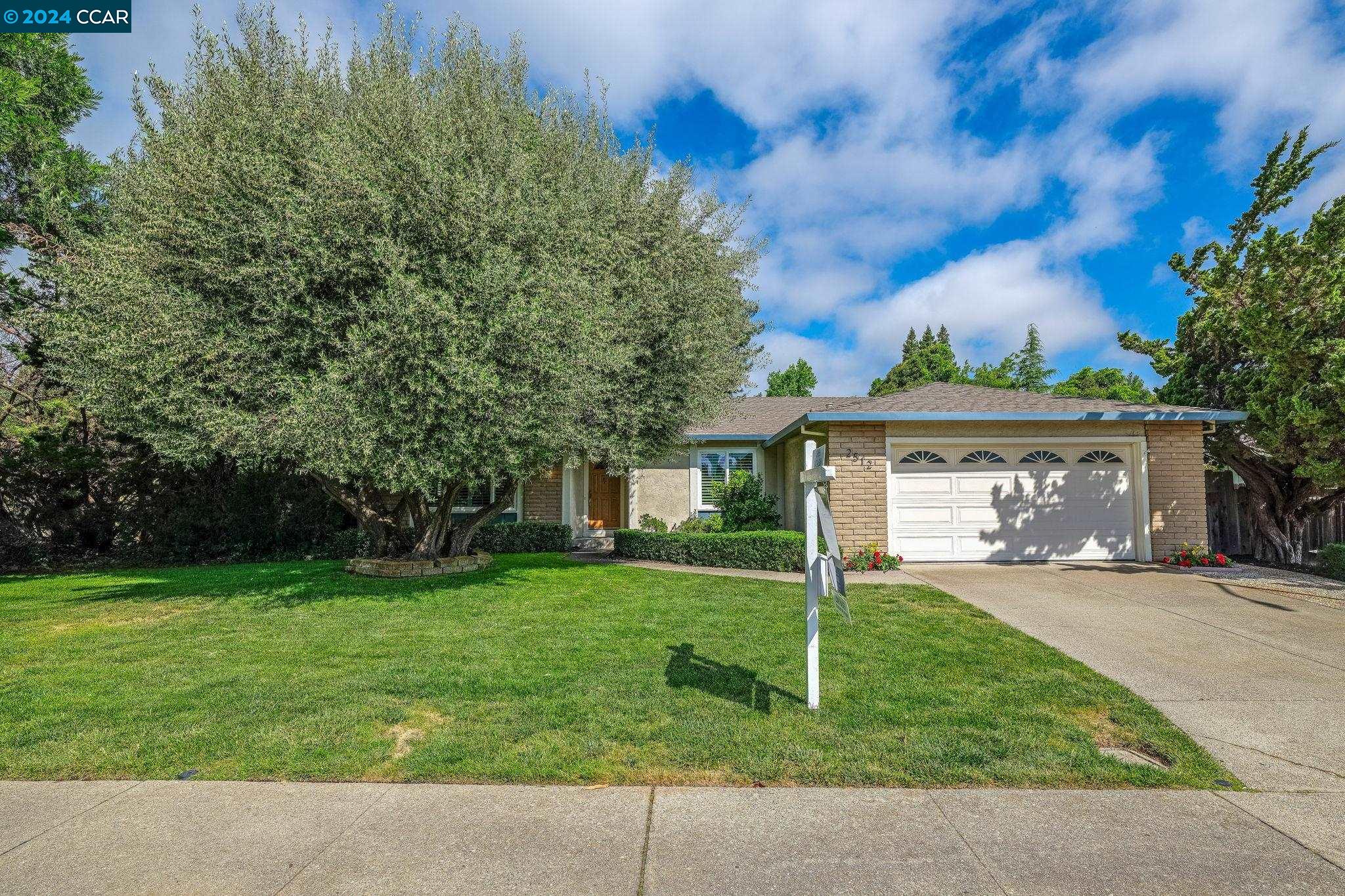 2512 Dos Rios Drive San Ramon, CA 94583 - Photo 1 of 1 a front view of a house with a yard and garage