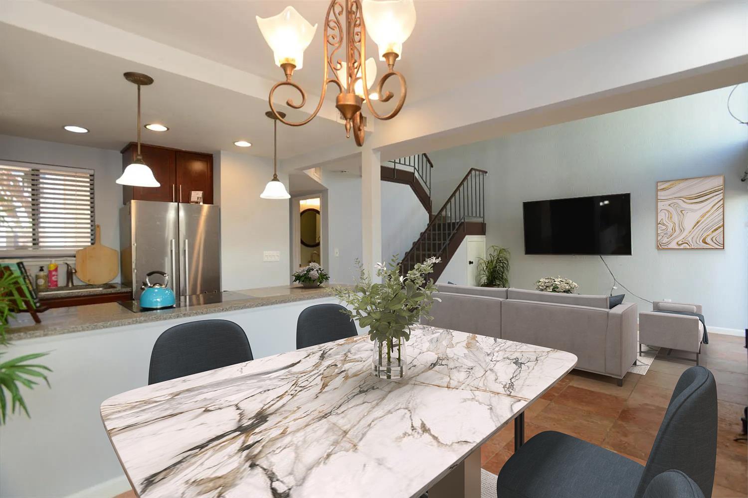 a large kitchen with a table and chairs