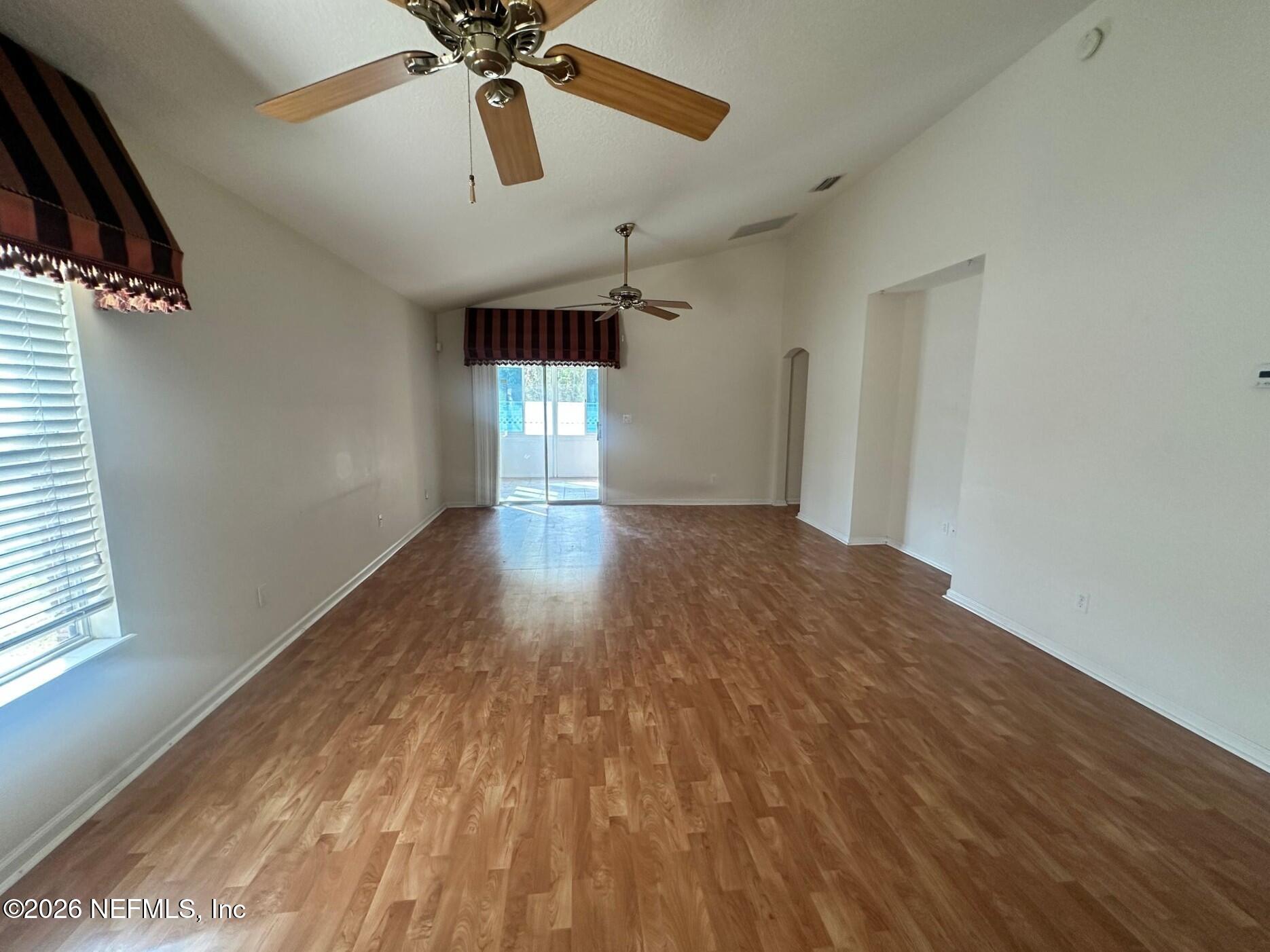 1721 Keswick Road St. Augustine, FL 32084 - Photo 6 of 17 a view of empty room with wooden floor and fan