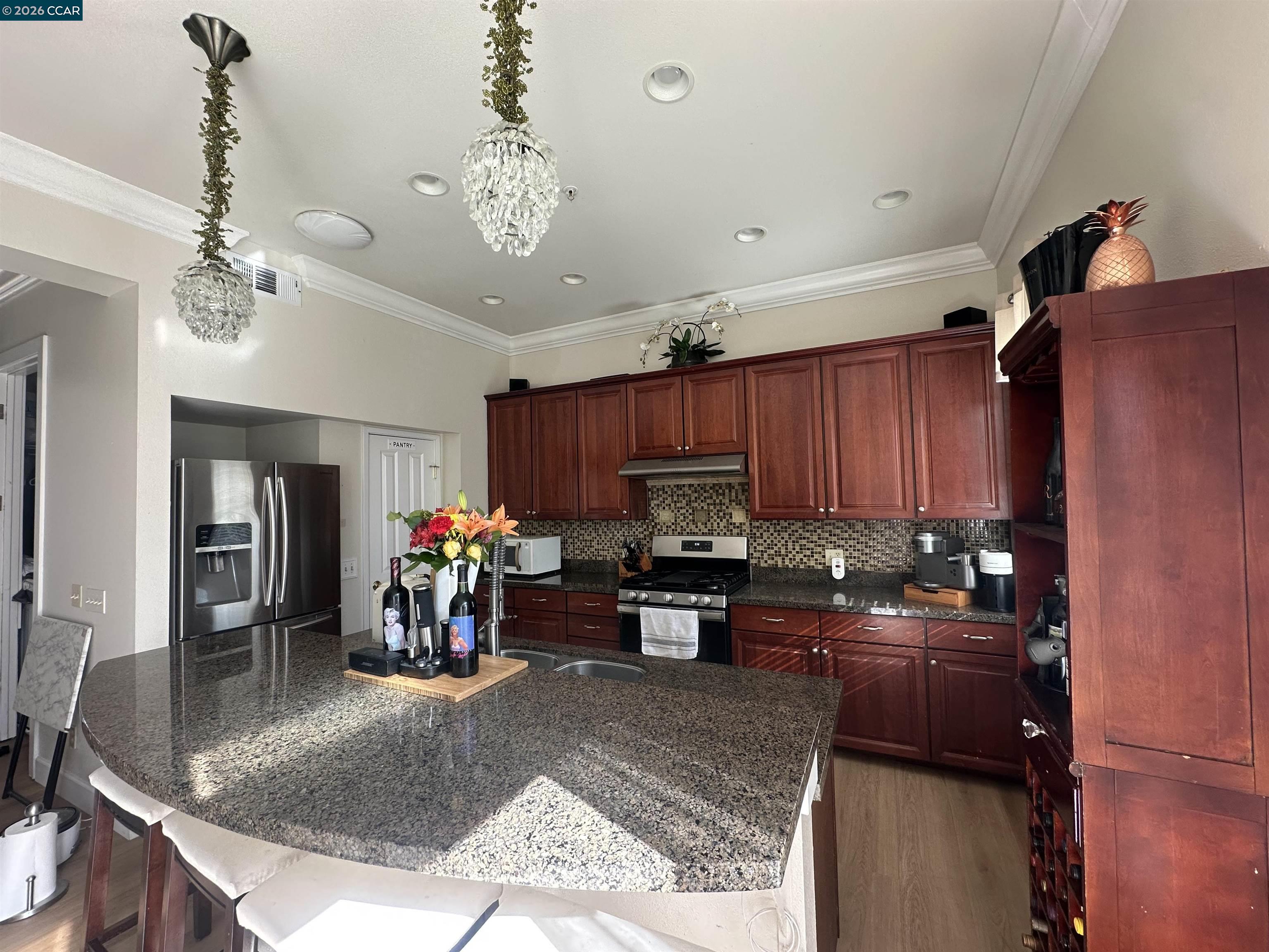 2144 Railroad Avenue Hercules, CA 94547 - Photo 18 of 29 a kitchen with a refrigerator and a sink