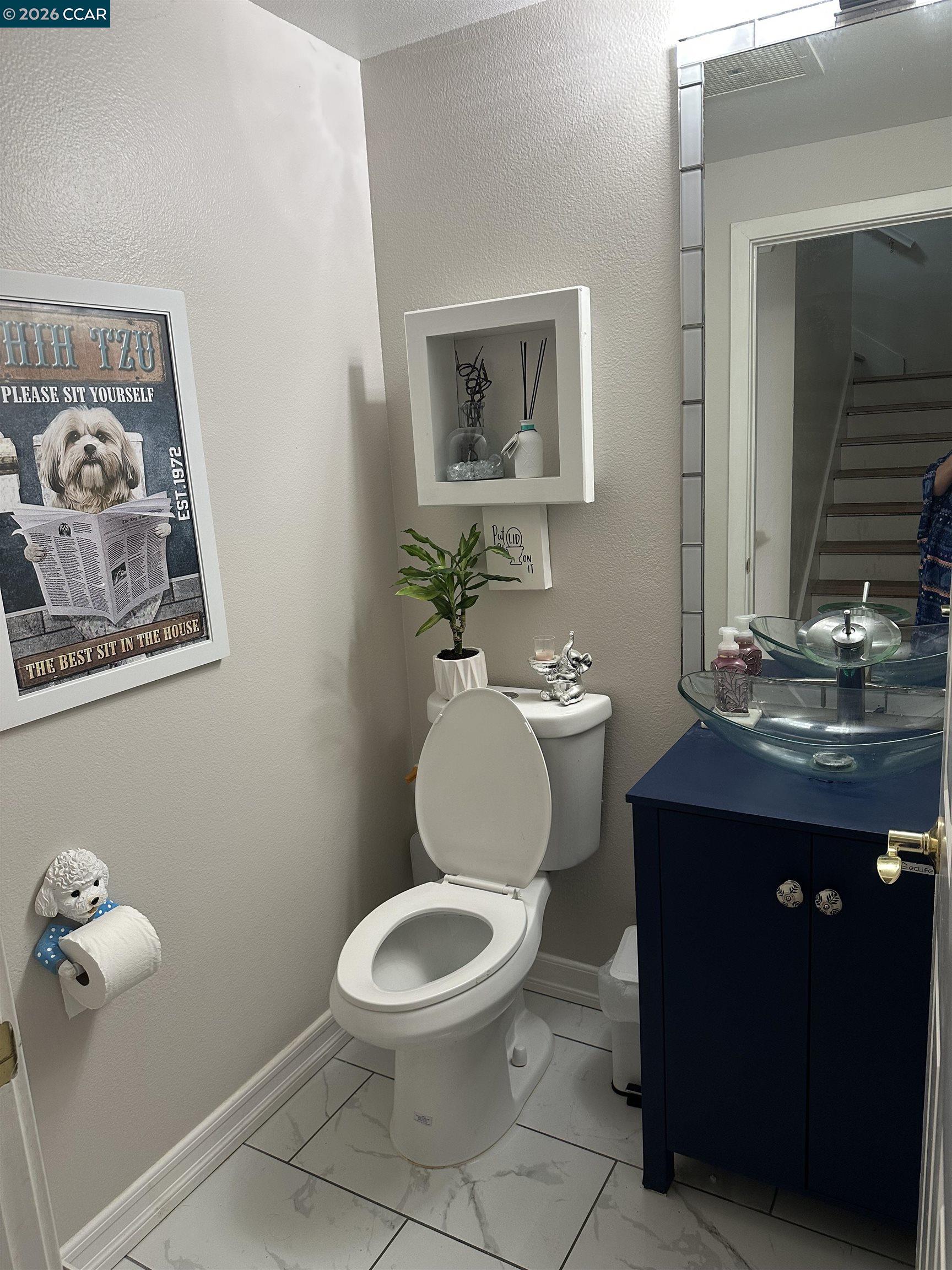 2144 Railroad Avenue Hercules, CA 94547 - Photo 24 of 29 a bathroom with a toilet a sink and mirror
