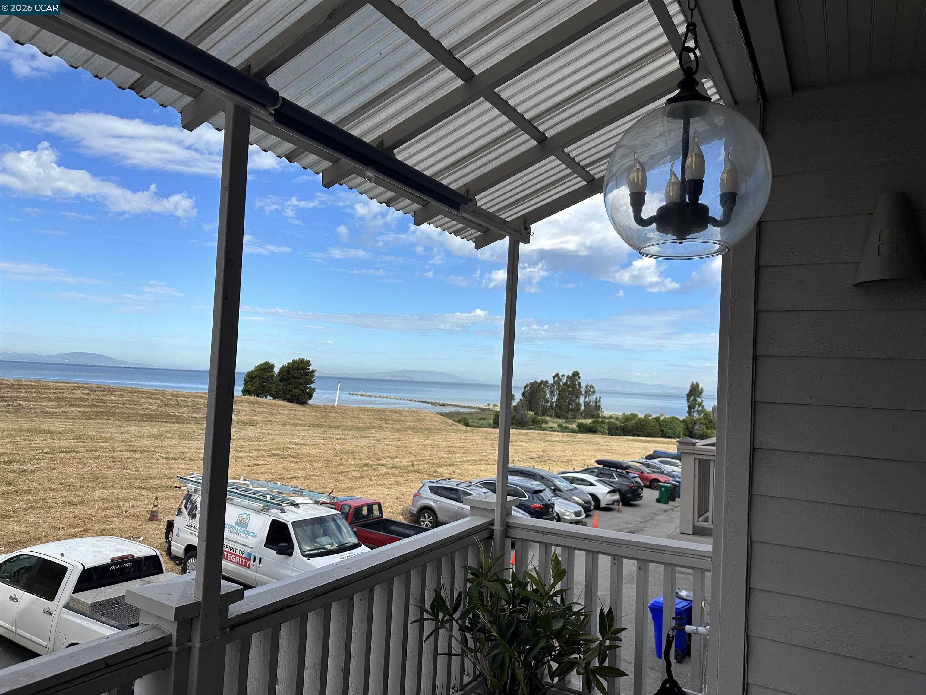 2144 Railroad Avenue Hercules, CA 94547 - Photo 29 of 29 a view of a balcony with floor to ceiling windows with wooden floor