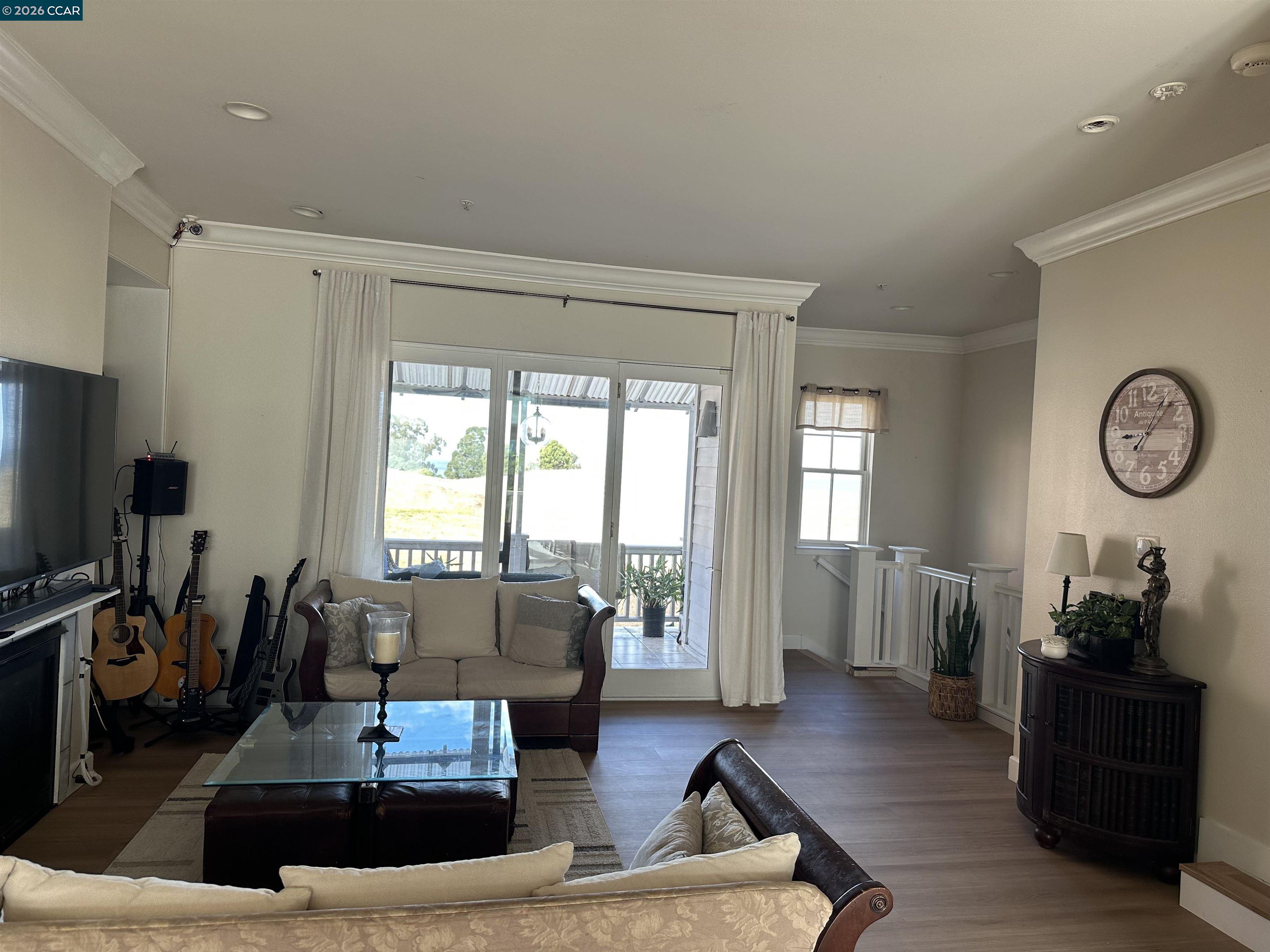 2144 Railroad Avenue Hercules, CA 94547 - Photo 10 of 29 a living room with furniture a large window and wooden floor