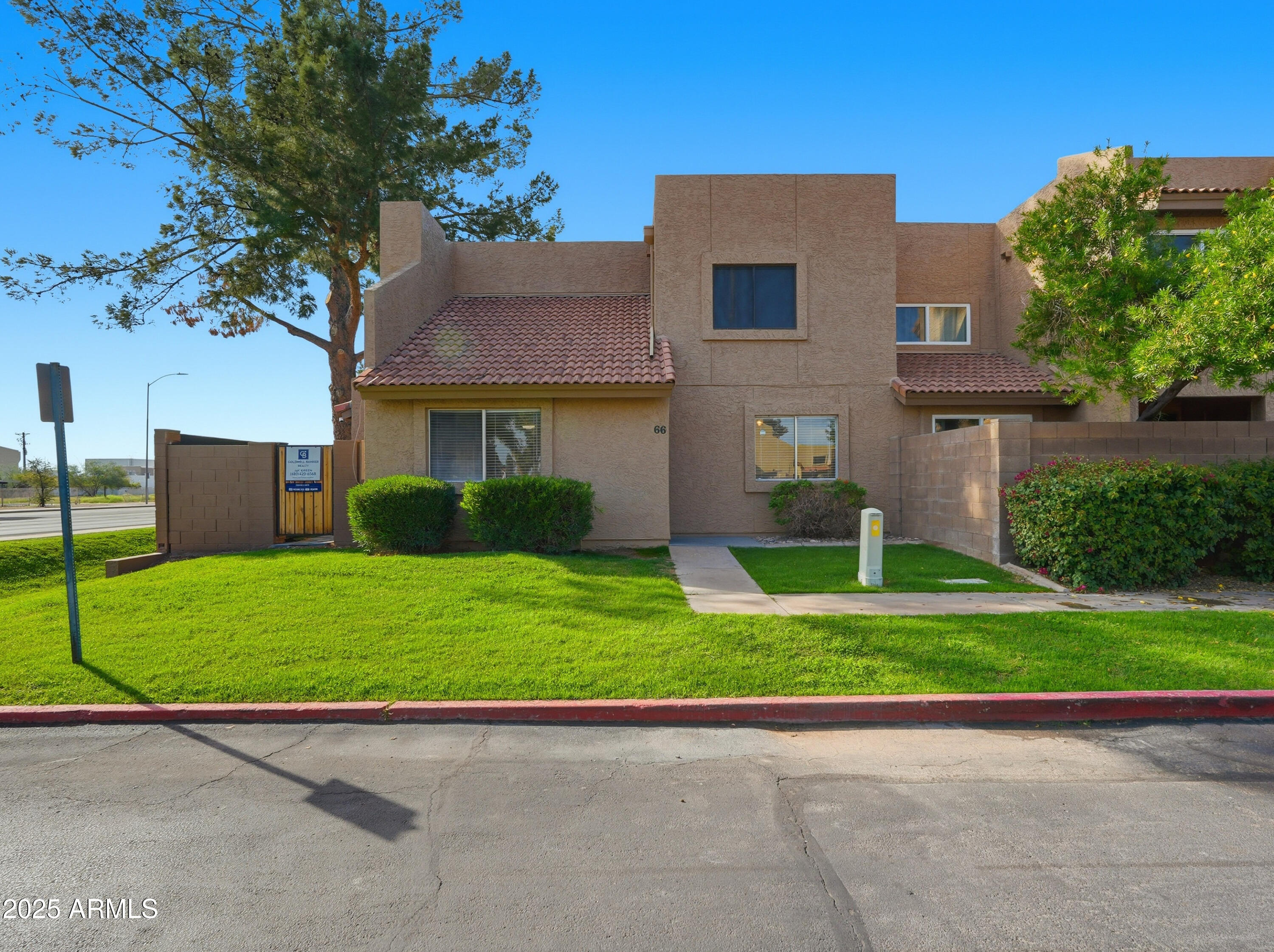 a house view with a garden space