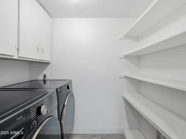 a view of room with washer and dryer