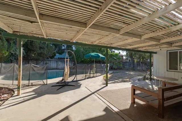a view of a swimming pool with a patio