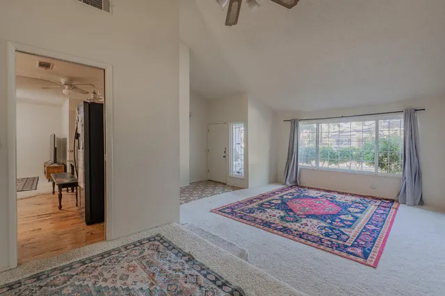a living room with a rug