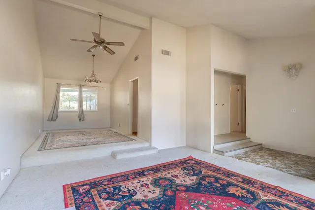 a view of an empty room and window