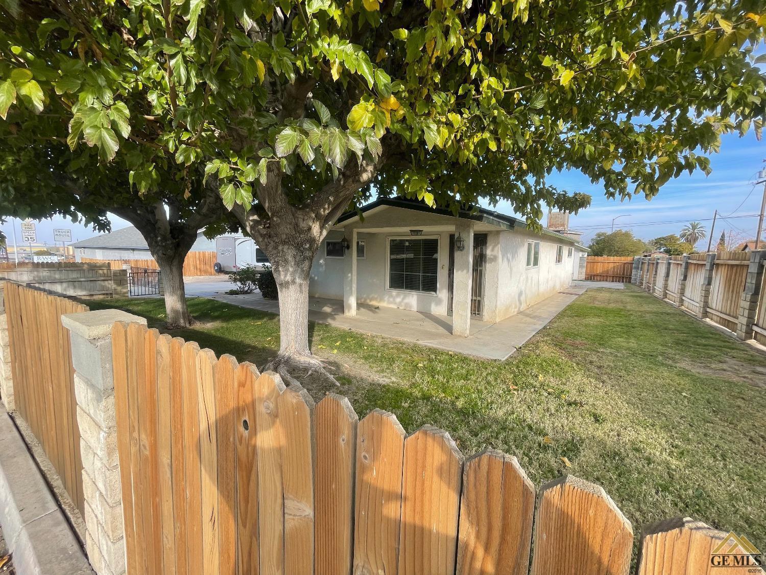 Undisclosed Address Taft, CA 93268 - Photo 1 of 24 a front view of a house with garden